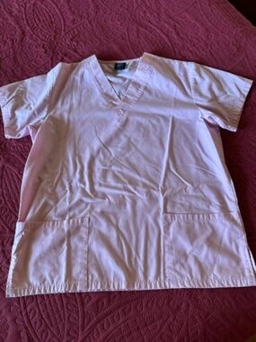 Pink scrub top/ pockets in front/size x small   great cond